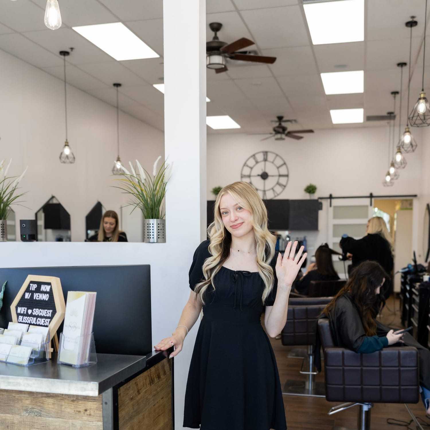 Portrait of Dezi, a professional stylist at Salon Blissful Med Spa, showcasing their expertise and style.