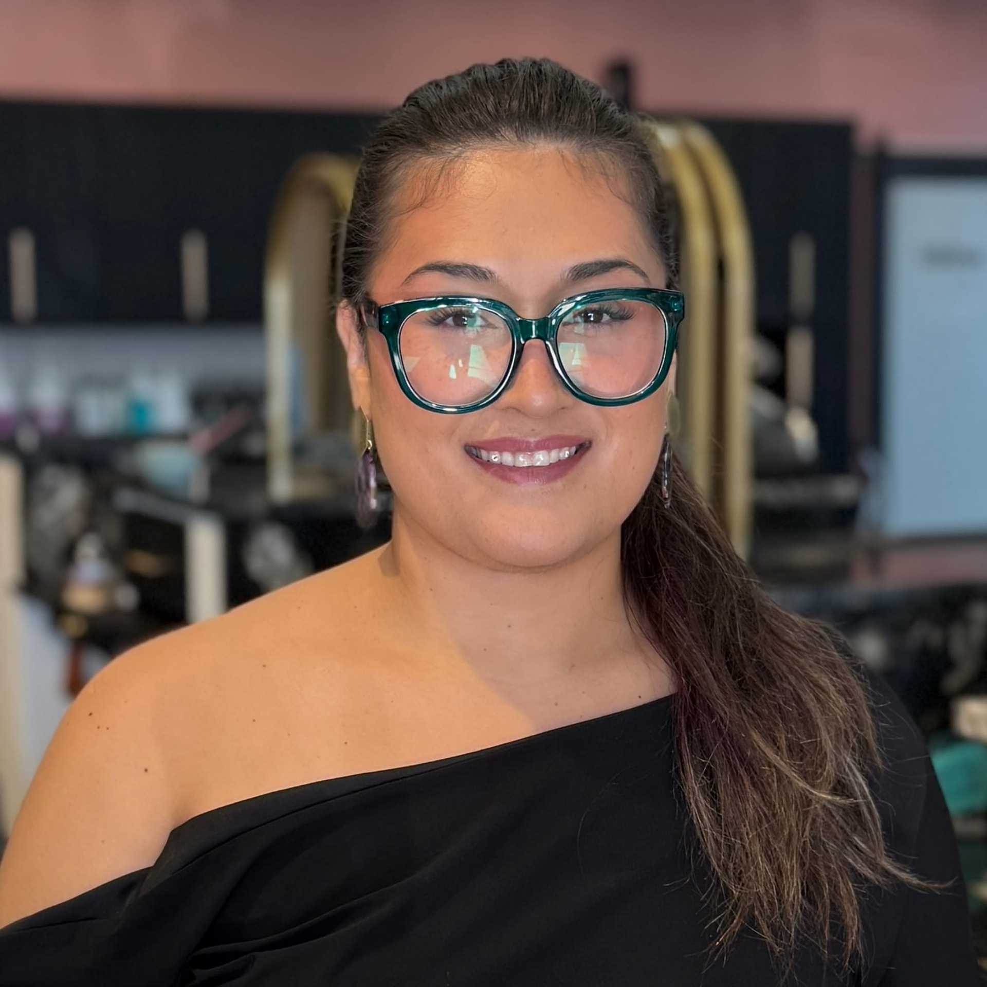 Portrait of Teyah, a professional stylist at Salon Blissful Med Spa, showcasing their expertise and style.