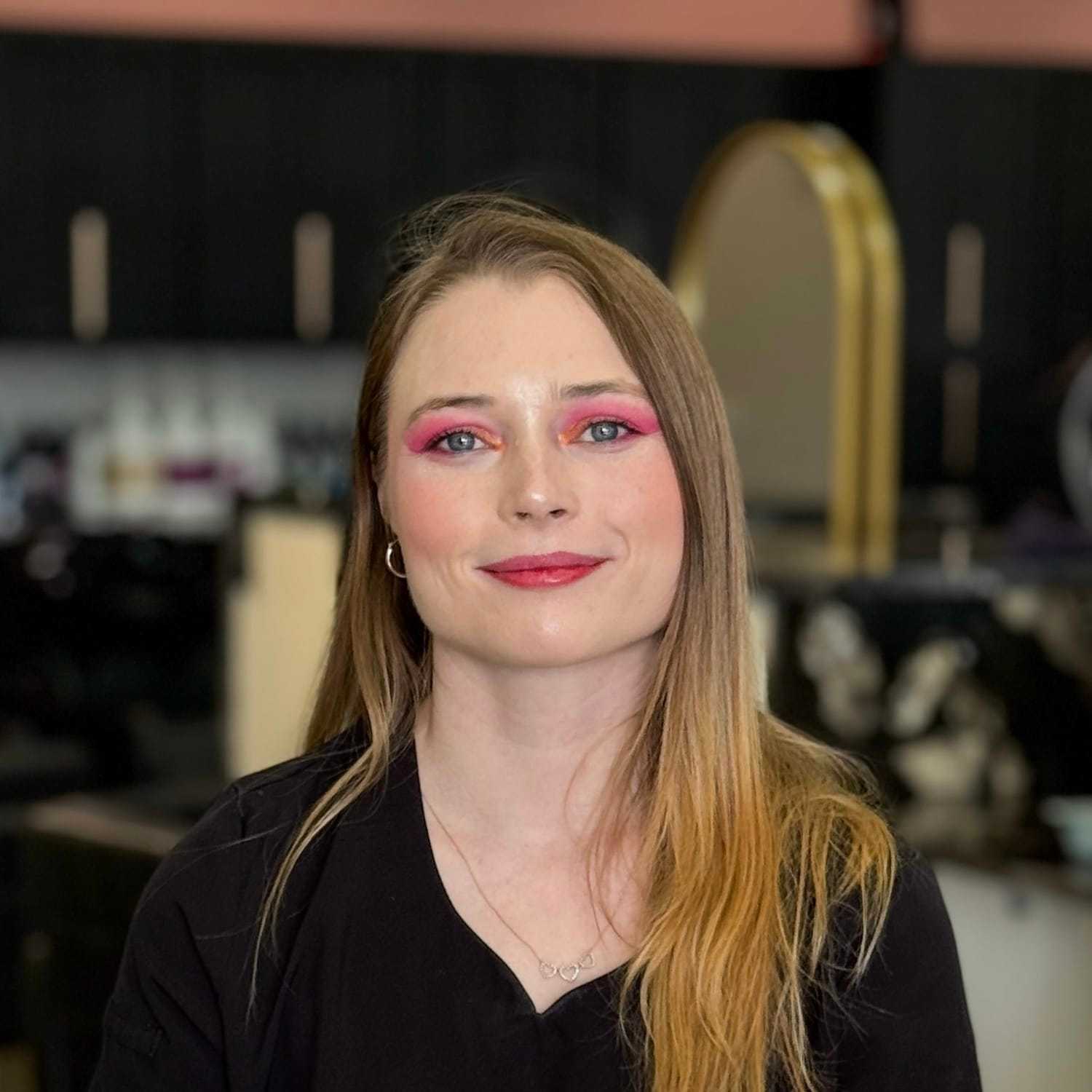 Portrait of Audrey, a professional stylist at Salon Blissful Med Spa, showcasing their expertise and style.