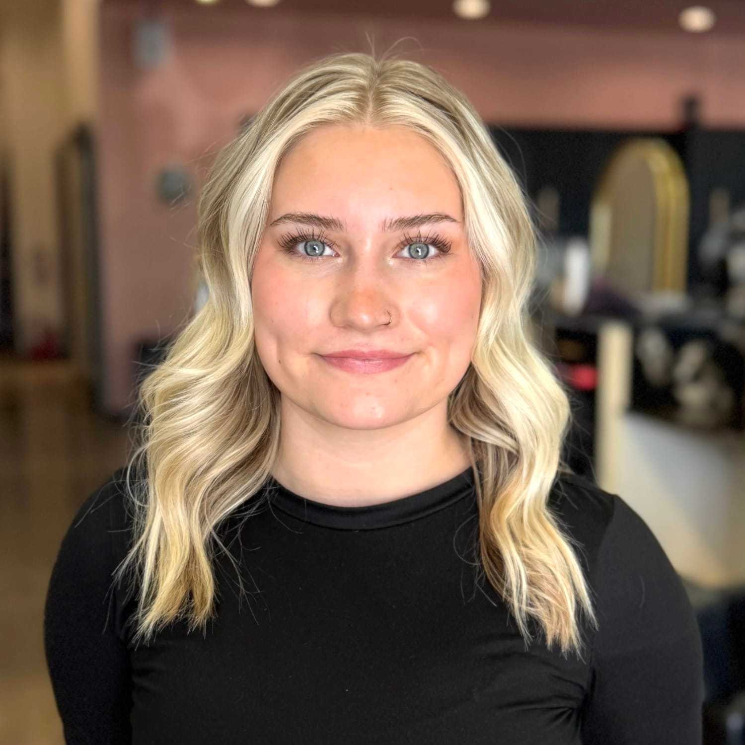 Portrait of Lexi, a professional stylist at Salon Blissful Med Spa, showcasing their expertise and style.