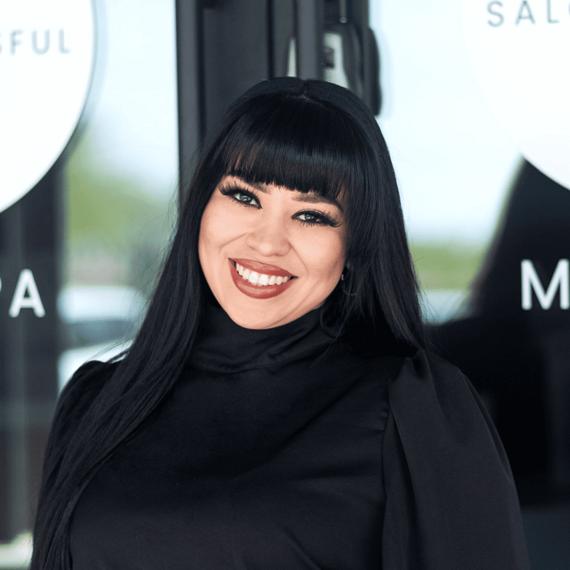 Portrait of Gina (North Peoria), a professional stylist at Salon Blissful Med Spa, showcasing their expertise and style.