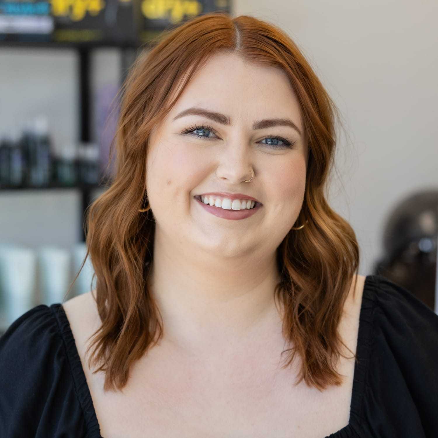 Portrait of Grace, a professional stylist at Salon Blissful Med Spa, showcasing their expertise and style.