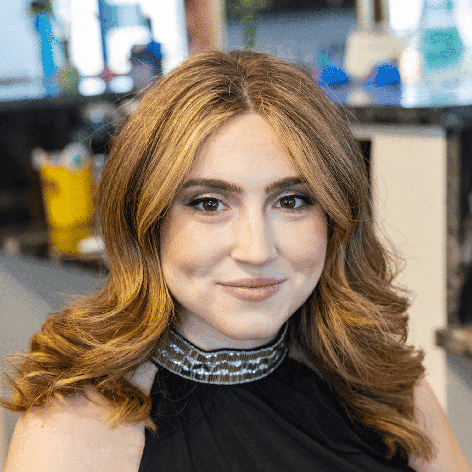 Portrait of Daniella, a professional stylist at Salon Blissful Med Spa, showcasing their expertise and style.