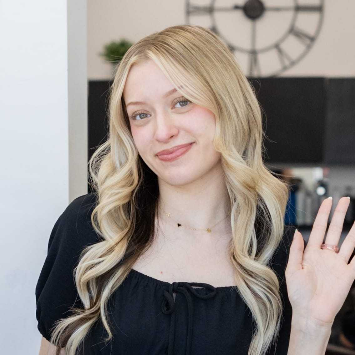 Portrait of Dezi, a professional stylist at Salon Blissful Med Spa, showcasing their expertise and style.