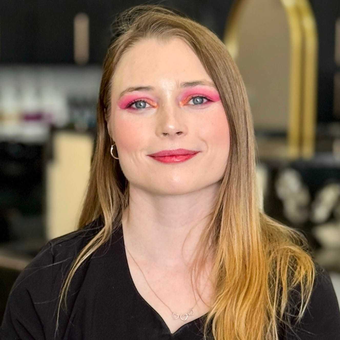 Portrait of Audrey, a professional stylist at Salon Blissful Med Spa, showcasing their expertise and style.