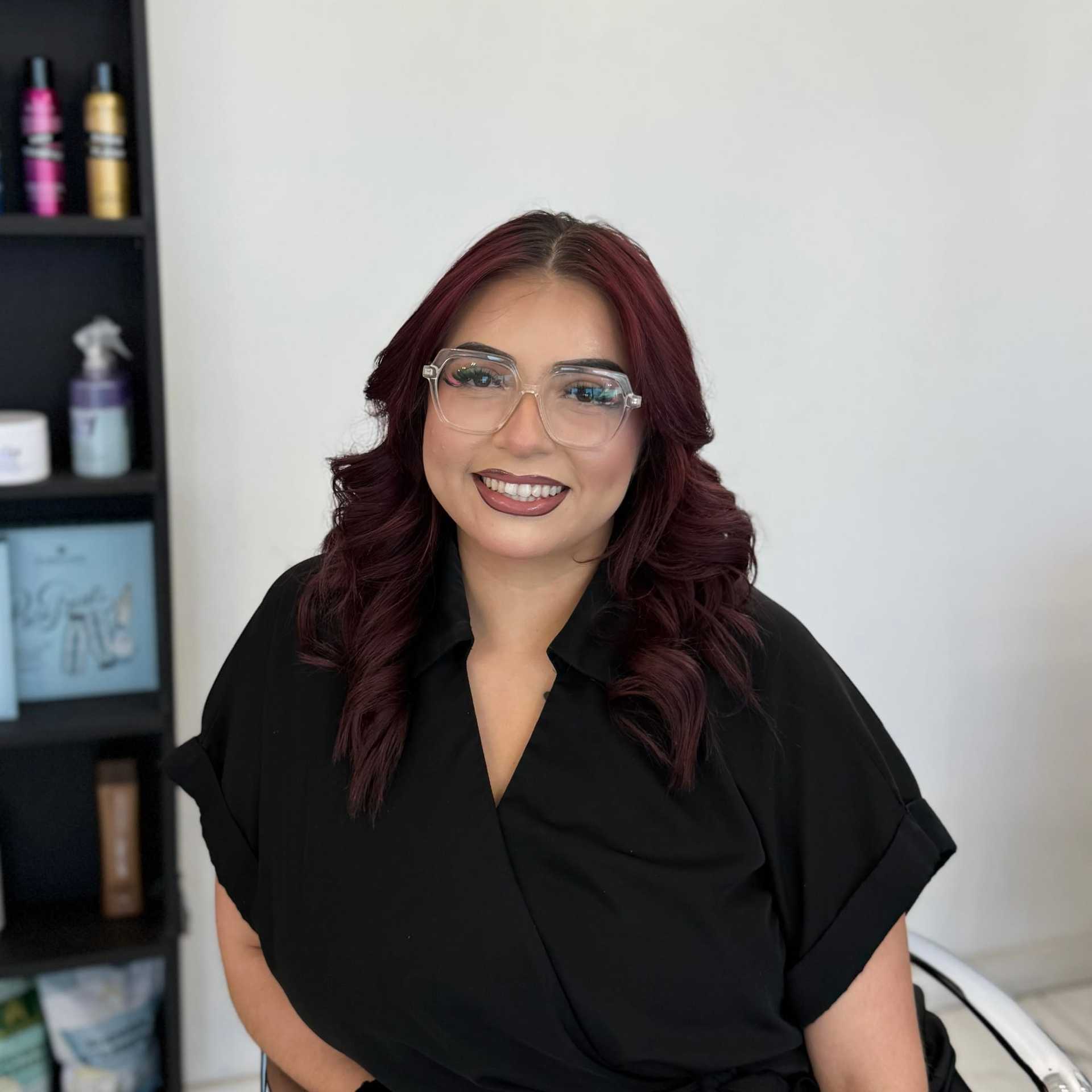 Portrait of Stacy, a professional stylist at Salon Blissful Med Spa, showcasing their expertise and style.