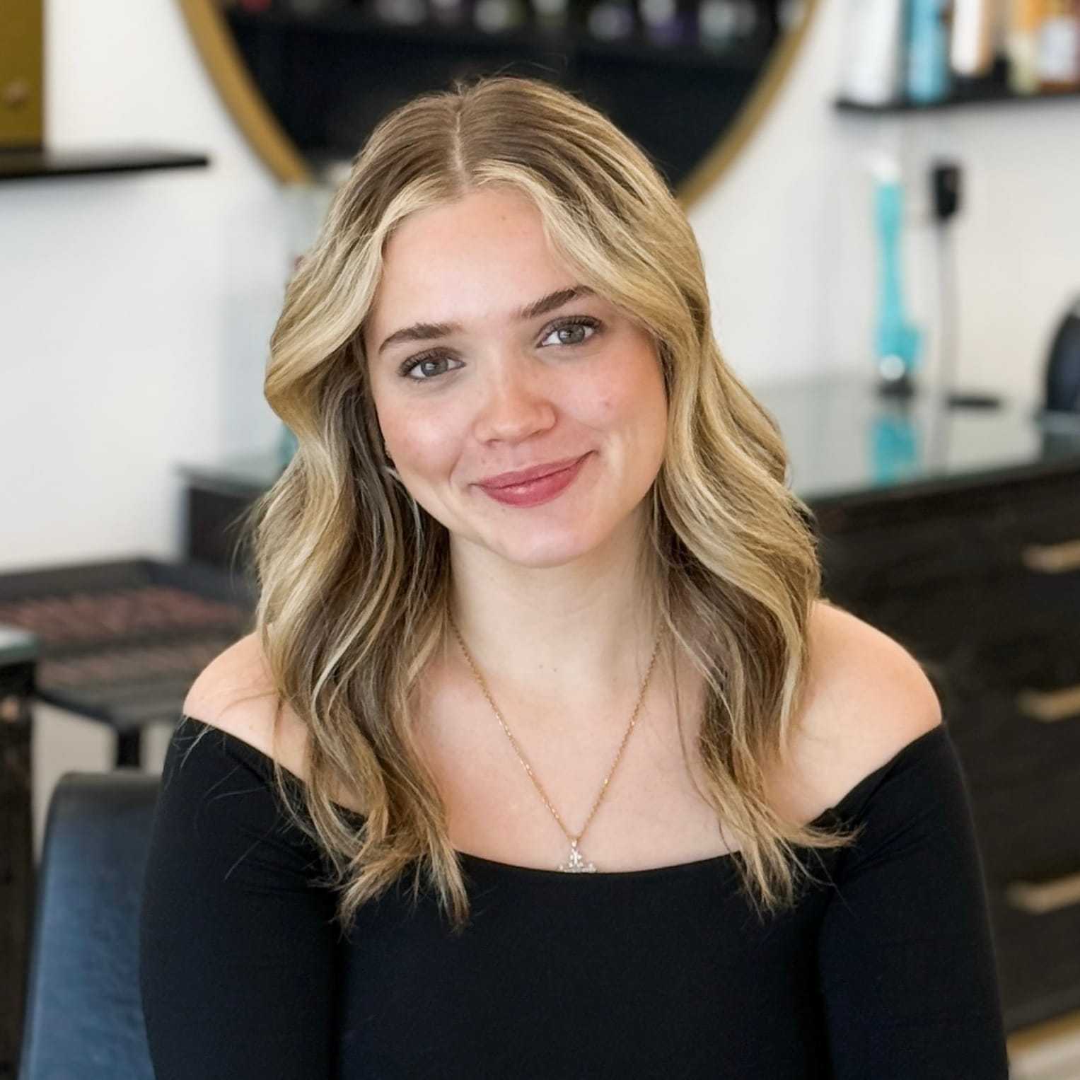 Portrait of Savannah, a professional stylist at Salon Blissful Med Spa, showcasing their expertise and style.