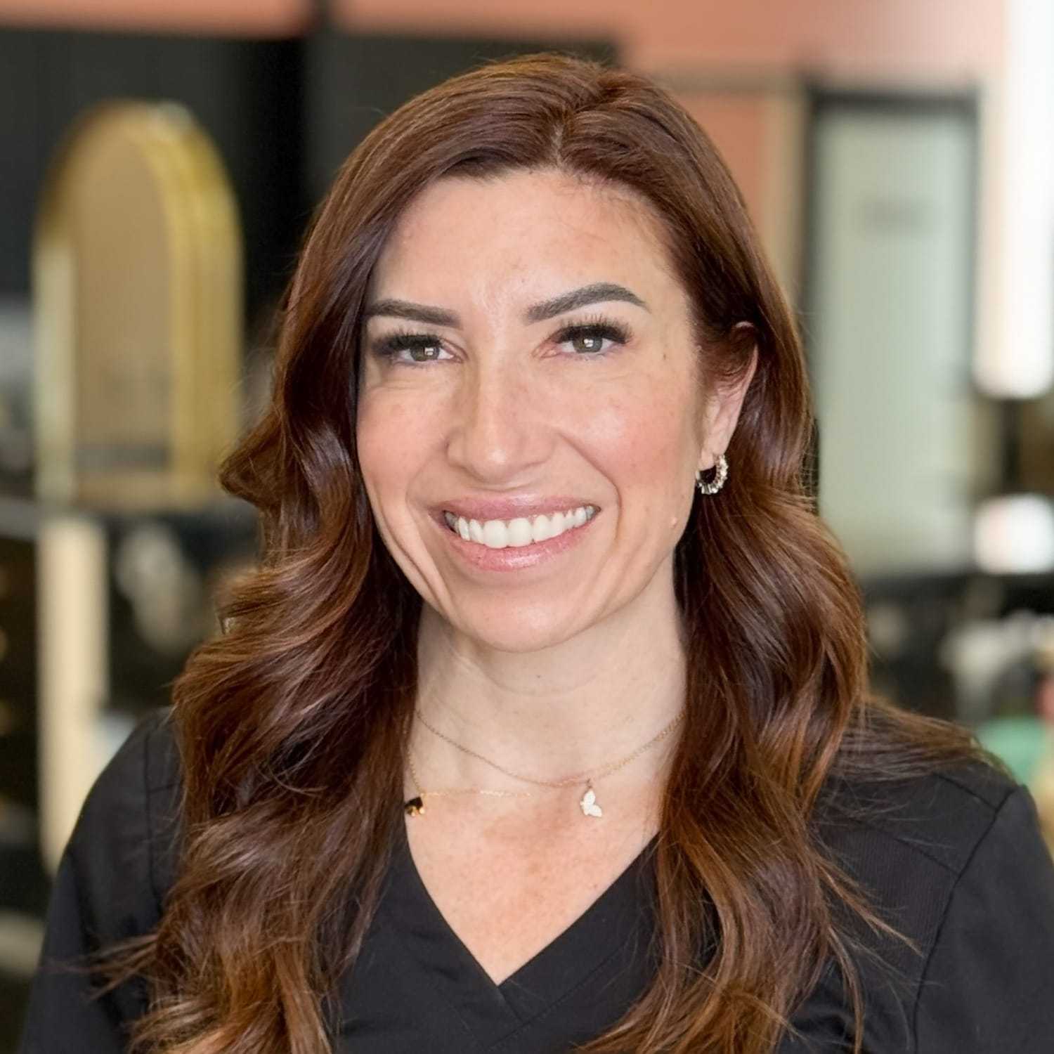 Portrait of Leigha, a professional stylist at Salon Blissful Med Spa, showcasing their expertise and style.