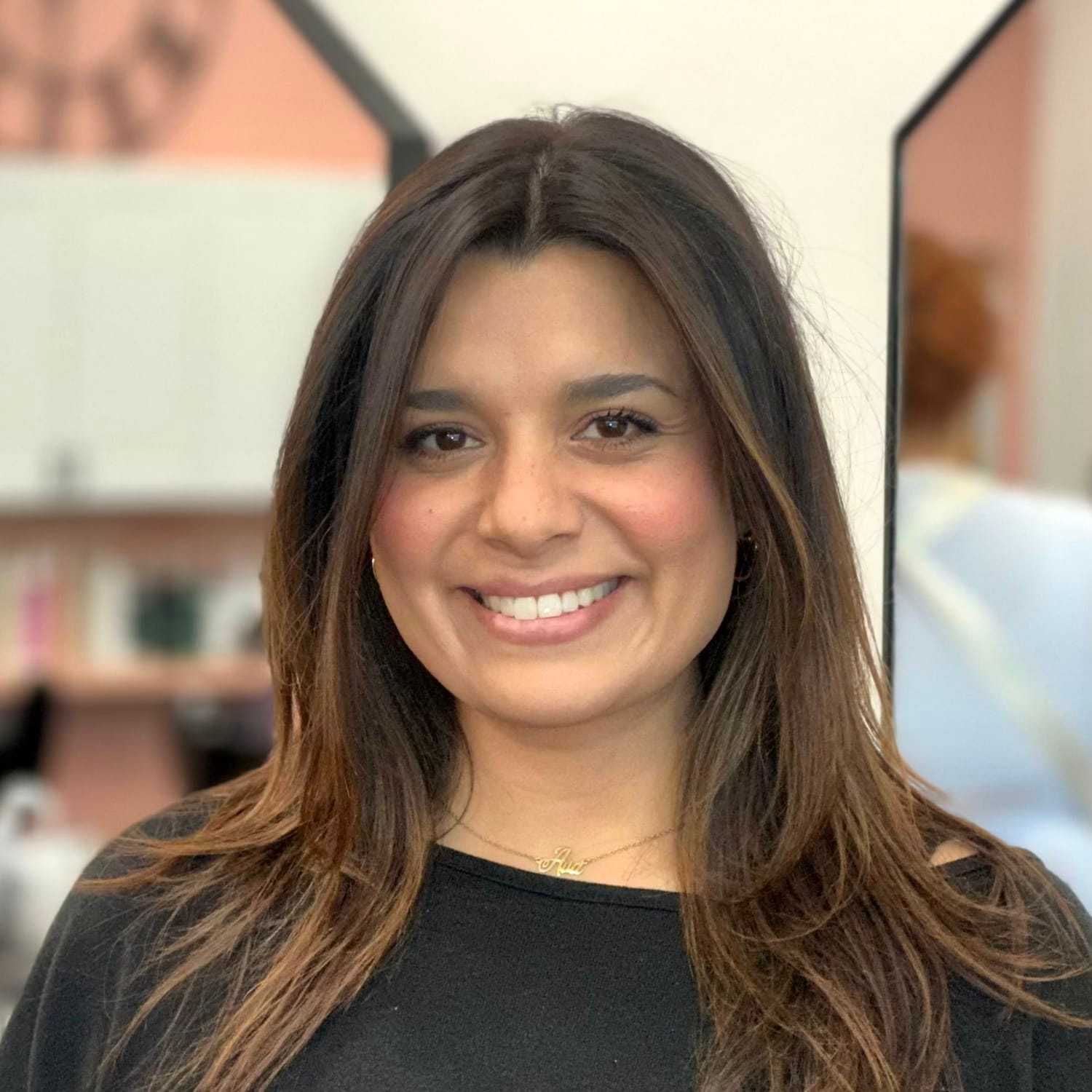 Portrait of Ericka, a professional stylist at Salon Blissful Med Spa, showcasing their expertise and style.