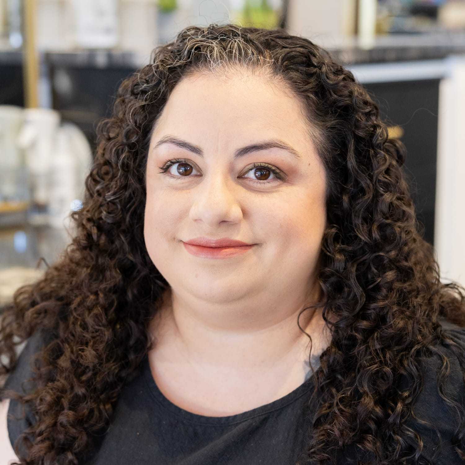 Portrait of Maxine, a professional stylist at Salon Blissful Med Spa, showcasing their expertise and style.