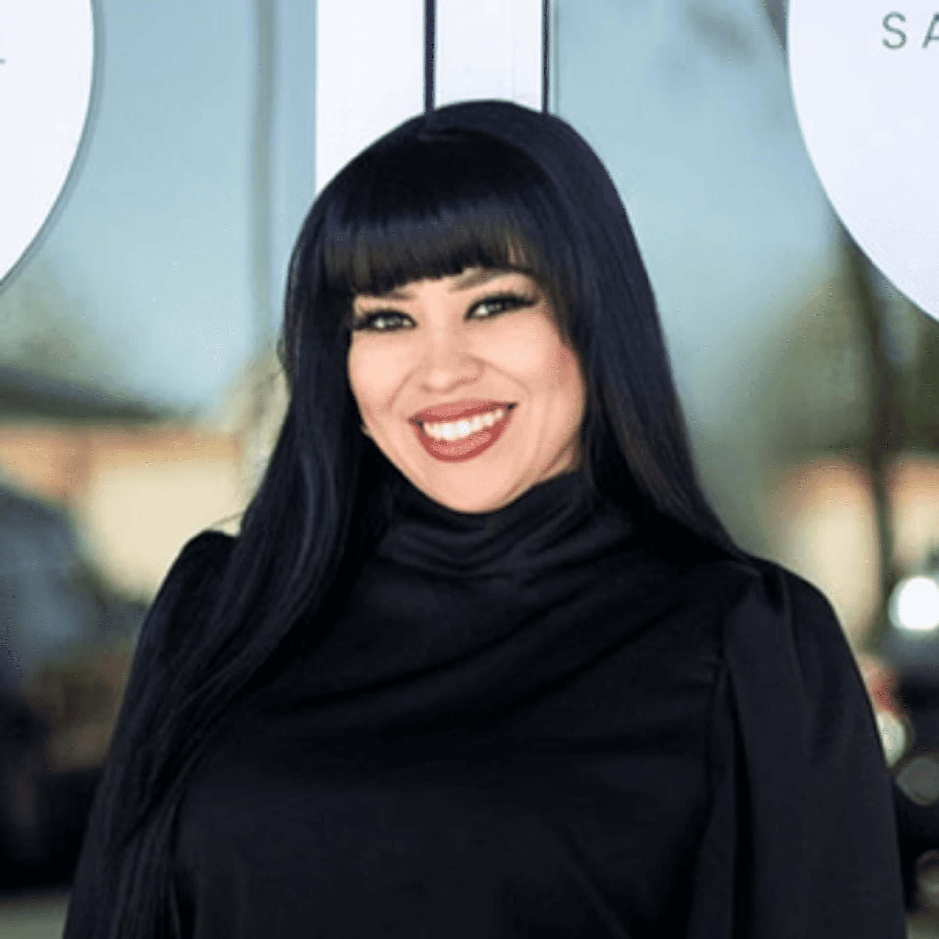 Portrait of Gina, a professional stylist at Salon Blissful Med Spa, showcasing their expertise and style.