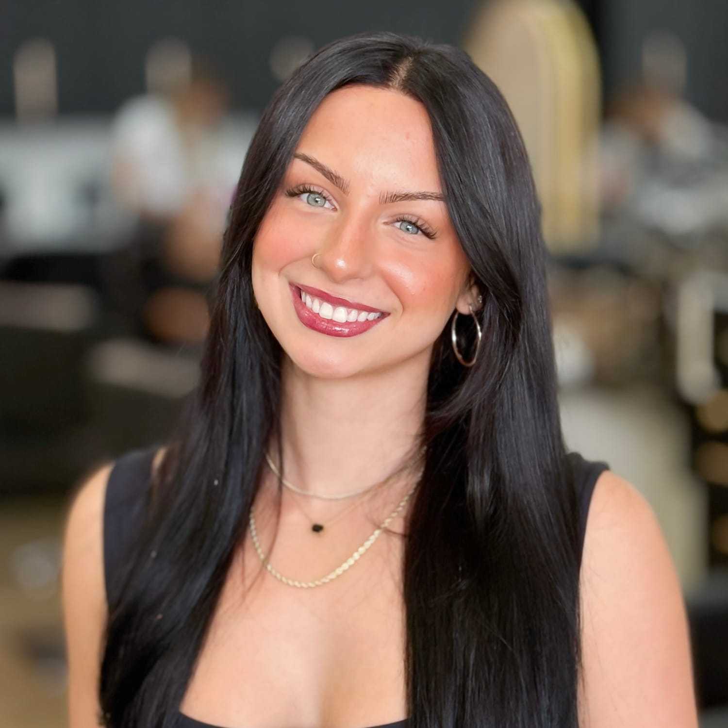 Portrait of Hollie, a professional stylist at Salon Blissful Med Spa, showcasing their expertise and style.