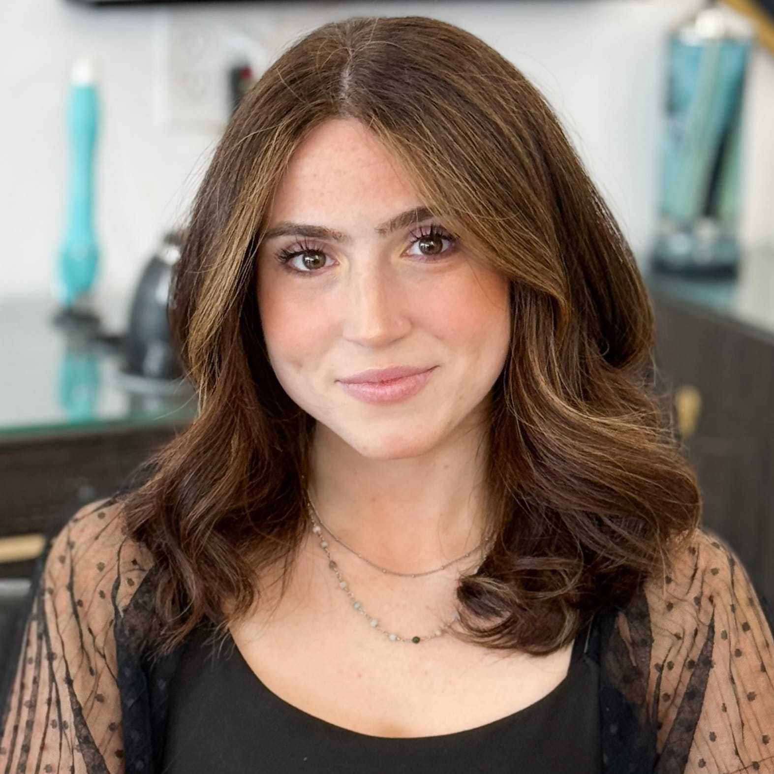 Portrait of Daniella, a professional stylist at Salon Blissful Med Spa, showcasing their expertise and style.