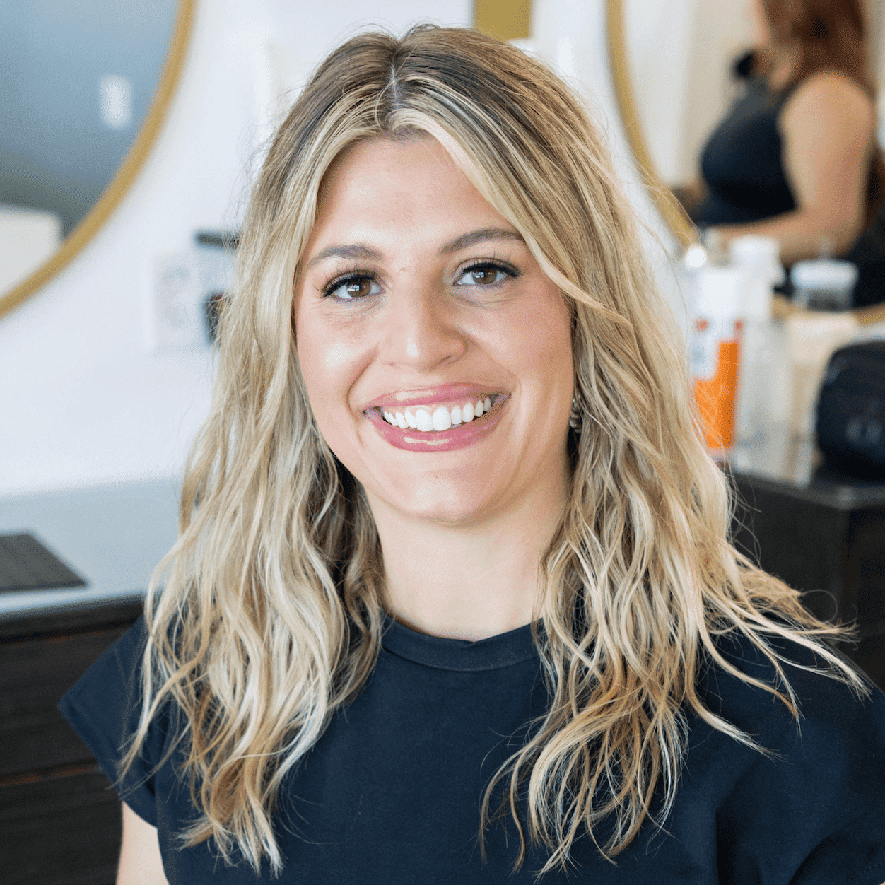 Portrait of Auburn, a professional stylist at Salon Blissful Med Spa, showcasing their expertise and style.