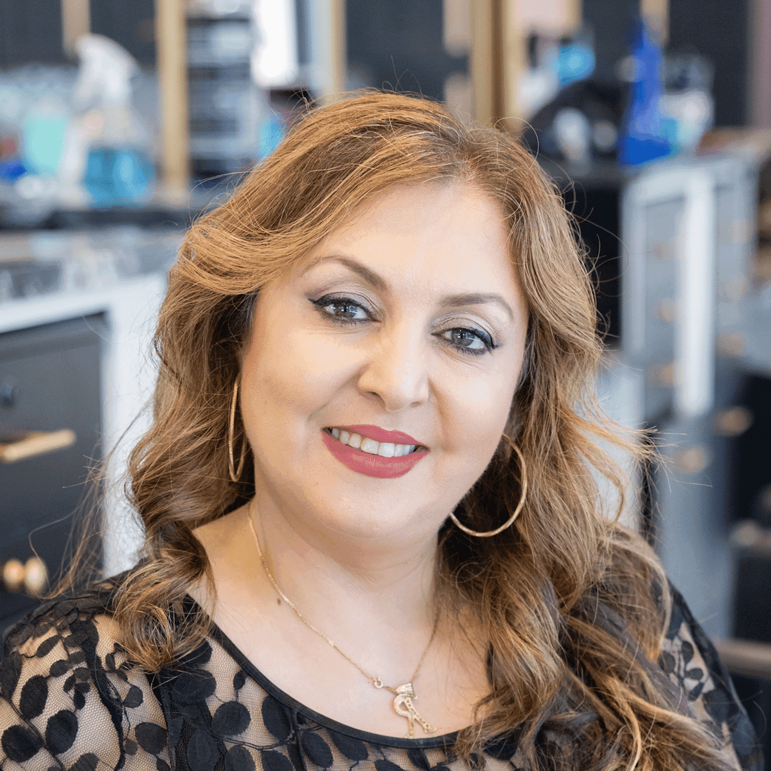 Portrait of Reem, a professional stylist at Salon Blissful Med Spa, showcasing their expertise and style.