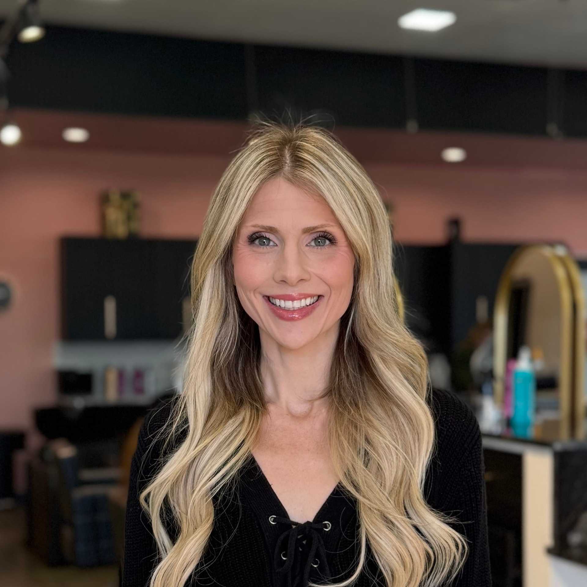 Portrait of Morgan, a professional stylist at Salon Blissful Med Spa, showcasing their expertise and style.