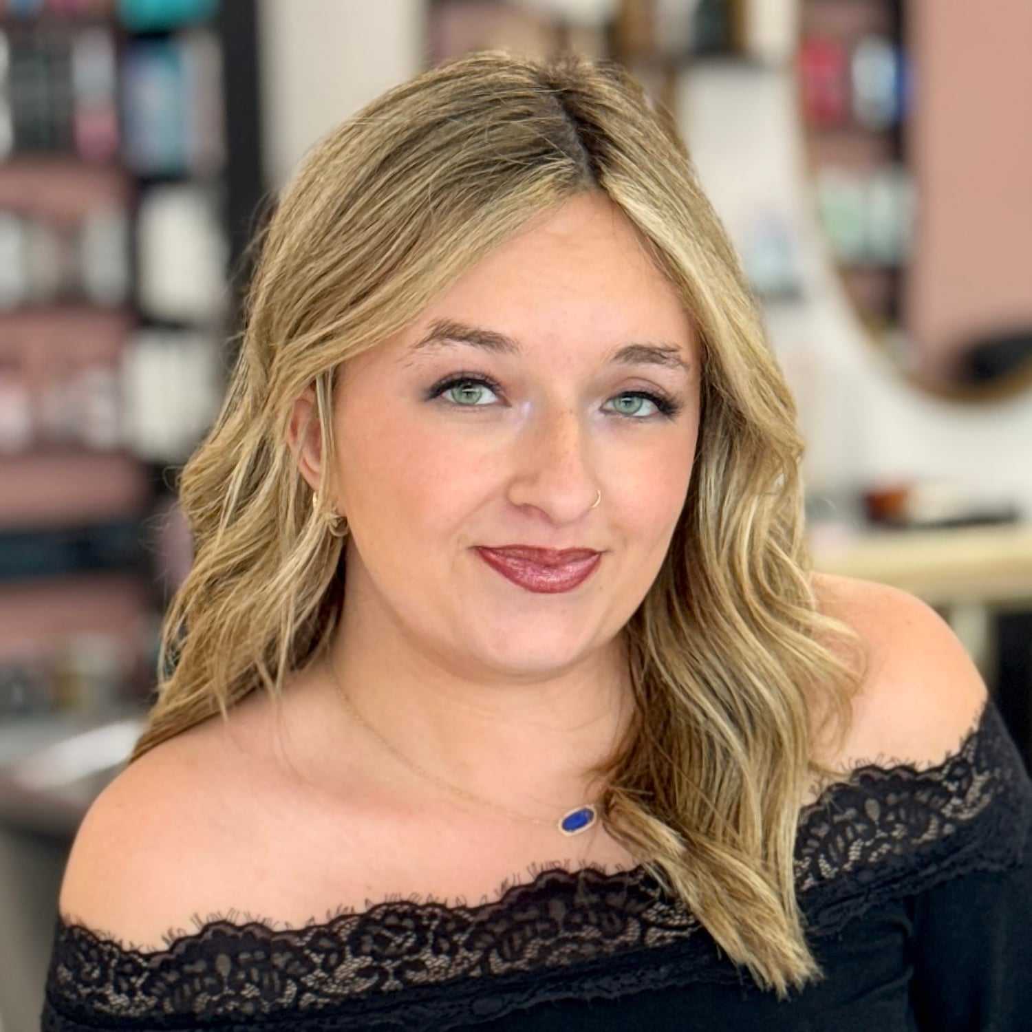 Portrait of Kelsi, a professional stylist at Salon Blissful Med Spa, showcasing their expertise and style.