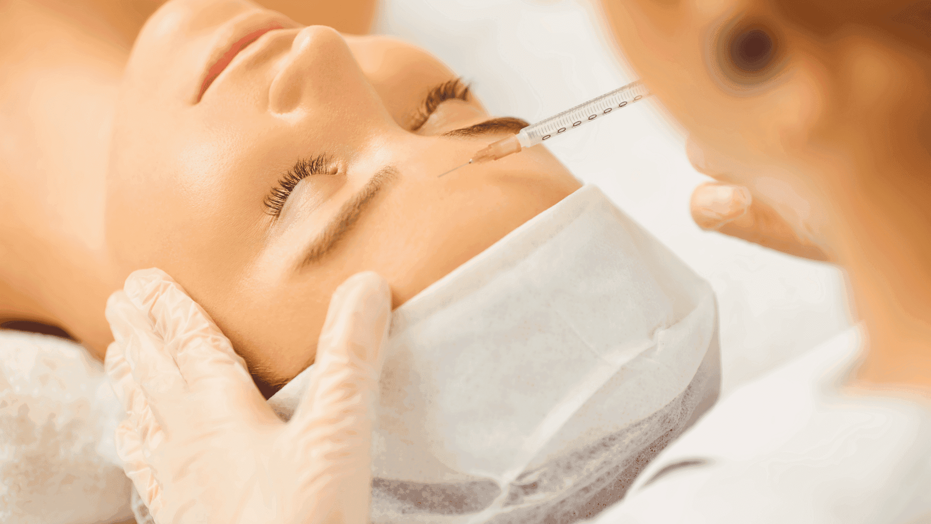 Dermatologist administering Botox injection to a patient's forehead in clinic.