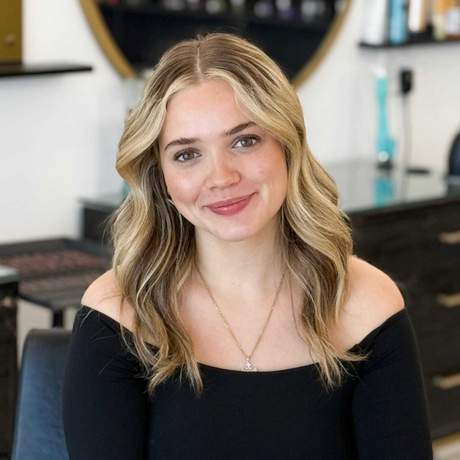 Portrait of Savannah, a professional stylist at Salon Blissful Med Spa, showcasing their expertise and style.
